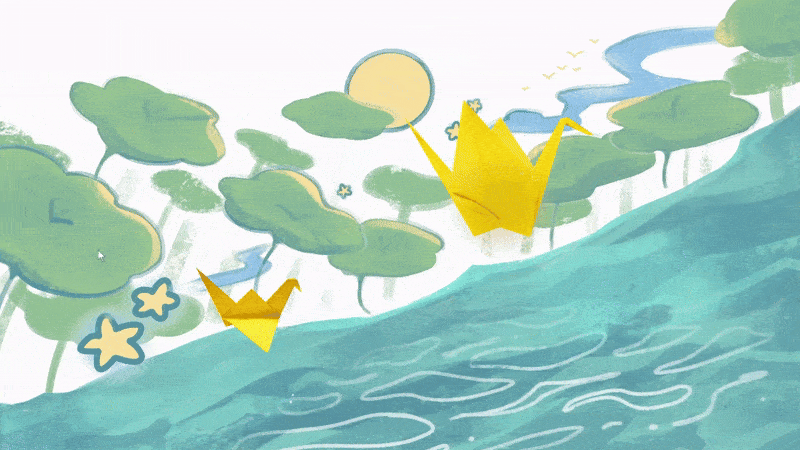 2 origami cranes flying against the mountains